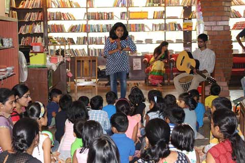 Children reading and listening in a story telling session
