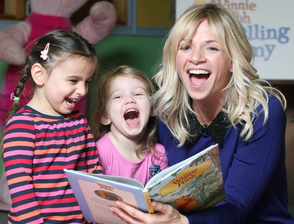 Mother enjoying reading with her children